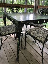 Glass Top Wrought Iron Table and 5 Chairs.