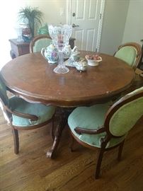 Round table with 4 upholstered chairs