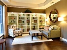 Contemporary streamlined designed arm chair, ottoman and sofa.