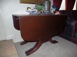Antique drop leaf table with extension leaves  and chairs