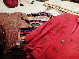 Walk in closet with designer women's clothing and shoes, large sizes