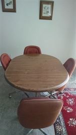 table set with four rolling chairs 