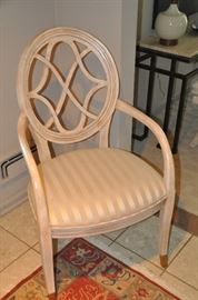 Great pierced back arm chair covered in satin oyster striped fabric. 24”w x 40”h x 22”d.