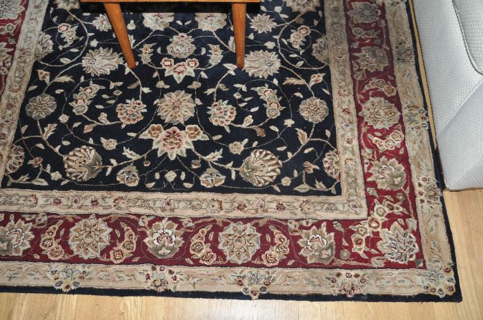 5’1” x 7’6” hand knotted 100% area rug in burgundy, black and sand.
