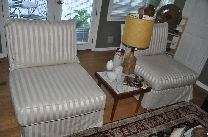Lovely pair of armless ivory Satin striped skirted chairs by Swaim. 27”w x 31”h x 33”d.