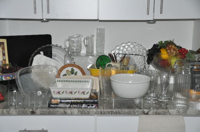 Glass serving pieces as well as a small kitchen TV available
