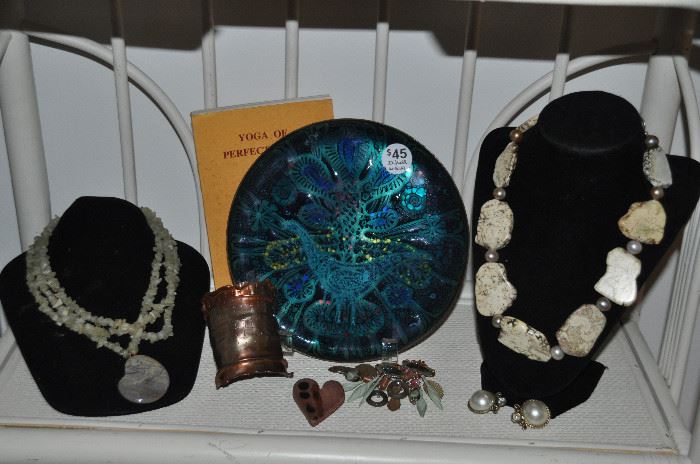 A sample of the great jewelry available! Shown with a mid century enamel plate