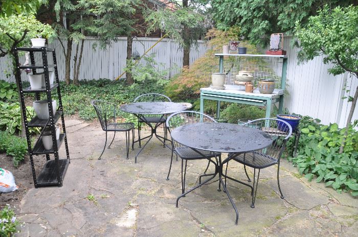 Two of the three outdoor wrought iron outdoor tables with 2 chair sets available