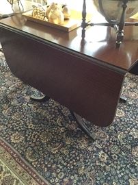 Duncan Phyfe drop leaf table with brass feet and extensions