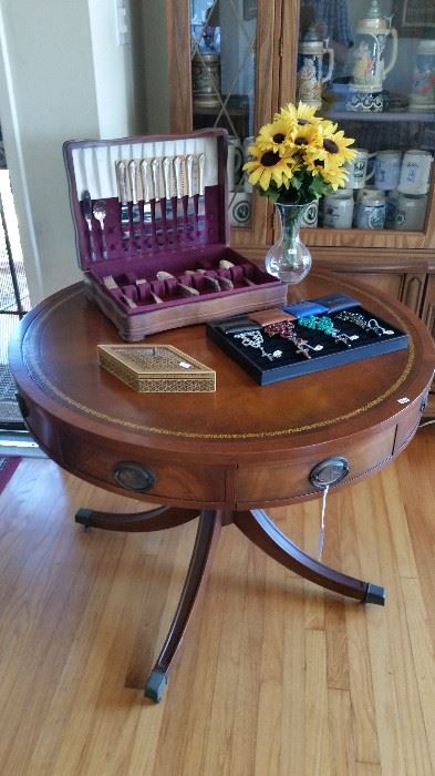 Vintage Mahogany drum table, Vintage silverware set.  Rosaries.