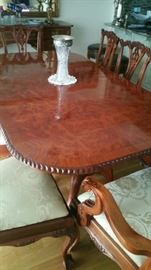 Table has two leaves and pads.  10 Chippendale style chairs (2 arm & 8 sides)