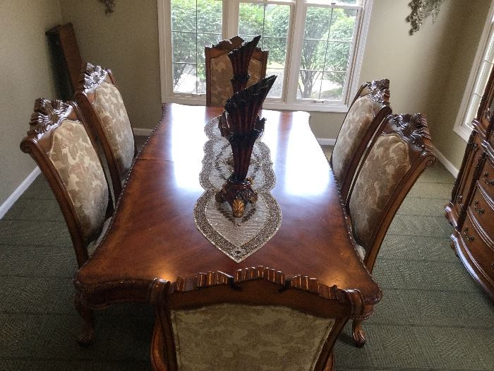 Greengrass Furniture Company.  Dining Table is 82'' Long without leaf insert X 44'' wide x 31'' High, one leaf extension measures at 15''.  China Cabinet Measures 71'' wide X 23''-24'' deep X 87'' high. Set Comes with Wood Table with claw feet comes with 4 side chairs and 2 captain chairs and china cabinet.  Traditional / Transitional Style