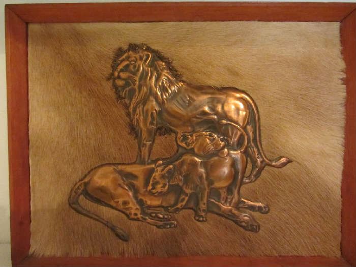 Embossed Copper Lions on Springbok Hide background