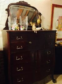 Antique, seven drawers, tall dresser with attached swivel mirror, ball and claw feet on petite rollers and small cabinet