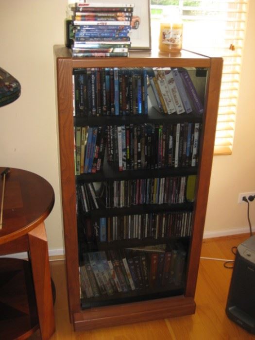 Media or electronic glass front cabinet, lot's of cd's, dvd's, some never opened