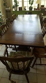 Table with 2  17" slide out ends  60" X 40" or 94" and 8 chairs.