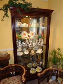 one of two curio cabinets