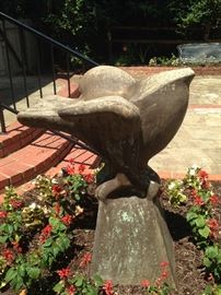 The sculpture is a bird "bird bath."