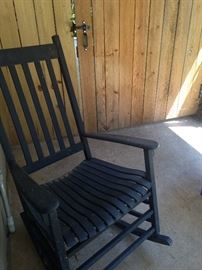 One of two black poolside rockers