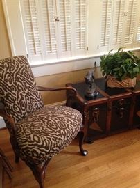 One of the chairs is an armchair.