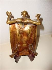 THE WIRE WAS  MOST LIKELY ADDED TO SECURE THE TRAY TO A STAND OR THE WALL.