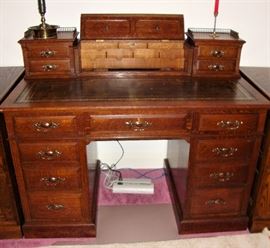 SUPERB LATE 19th CENTURY  "VICTORIAN WRITING DESK" WITH KEY - LEATHER TOP DESK WITH STATIONARY & INKWELL COMPARTMENTS ON TOP and CLOSING/OPENING DOOR. PIERCED BRASS GALLERIES ON EACH SIDE. POSSIBLY MADE OF MAHOGANY WITH ORIGINAL BRASS PLATE "ROYAL LONDON PARIS BUENOS AIRES MAPLE & CO".  THIS PIC SHOWS OPEN COMPARTMENT (SEE NEXT 2 PICS)