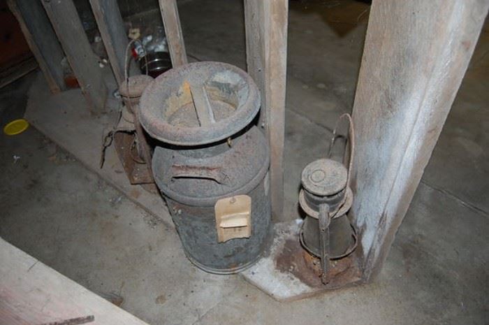 Old milk can, antique lanterns