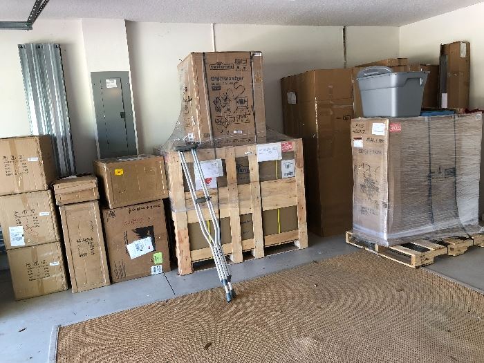 All new stainless steel kitchen appliances in the crates