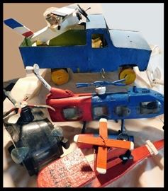 Handmade Primitive Wooden and Tin Toy Trucks, Helicopters, Planes and more.