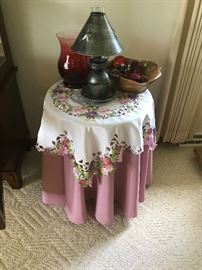 Small table and glass figurines and lamp