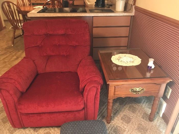 Red accent recliner chair with side table