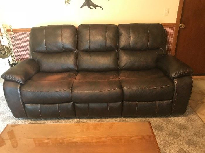 Black leather couch with extending side chairs