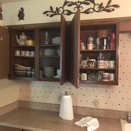 Wooden wall cabinet with cooking supplies