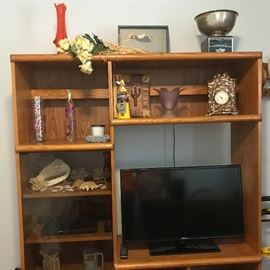 Office hutch with small flat screen TV and decor