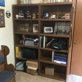 Large double wooden shelves with collectibles and art objects