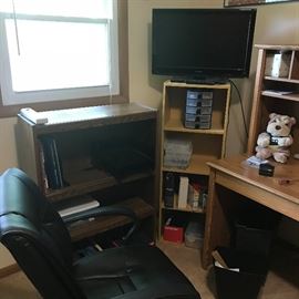 Desk chair and shelving with knick knacks and collectibles