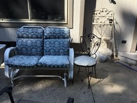 Outside on back patio - two person settee, chair and shelf