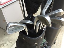 Golf clubs in previous bag