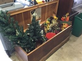 Cedar chest in Garage filled with holiday decor