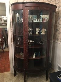 Antique Curio Cabinet 38"w X 62"h.                                            Tiger Oak Wood, Curved Glass on side panels.