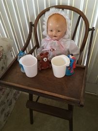 Composition Horseman doll in antique highchair