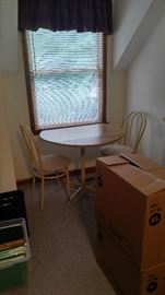 Small table and chairs in upstairs apartment