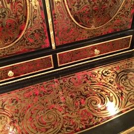 Close up of the Boulle writing desk with tortoise inlay and gilt bronze mounts. 