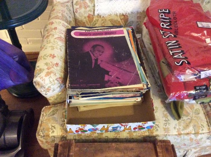 Sheet music and boxes of 33 records