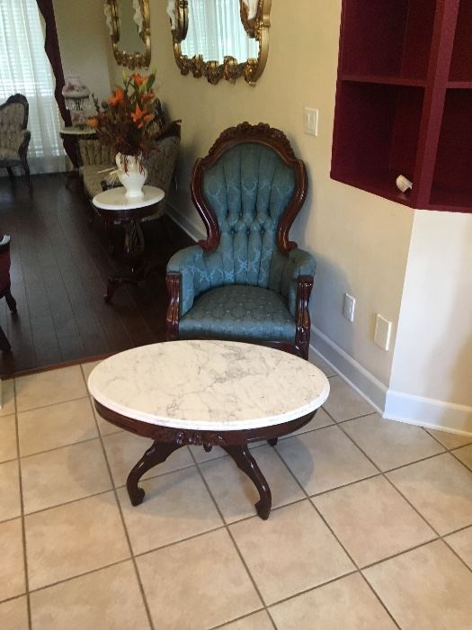 Antique wing chair and marble top table
