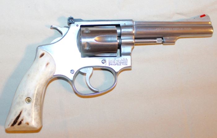 S & W Revolver .22LR SS (manufactured 1981)  (Stag handle, pinned front sight, with “cowboy” hand tooled belt & holster)