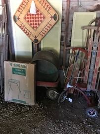 Carom Board, tricycle, wagon, two sleds, and T.V. trays