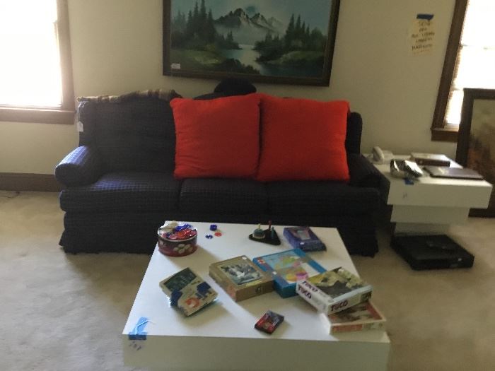 Vintage sofa, coffee table and oil painting.