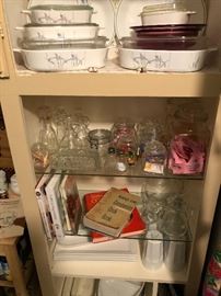 a cabinet full in the kitchen. interesting corning ware pattern