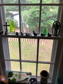 lots of pottery birds and glass